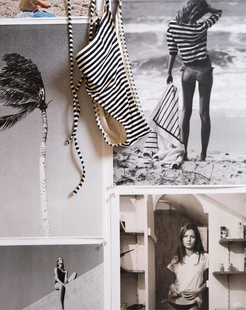 Collage of black and white photos featuring beach scenes and a striped swimsuit.