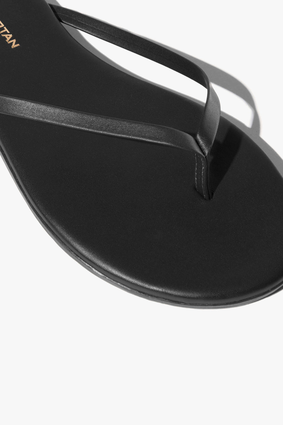 NL X TKEES LEATHER FLIP FLOP IN BLACK