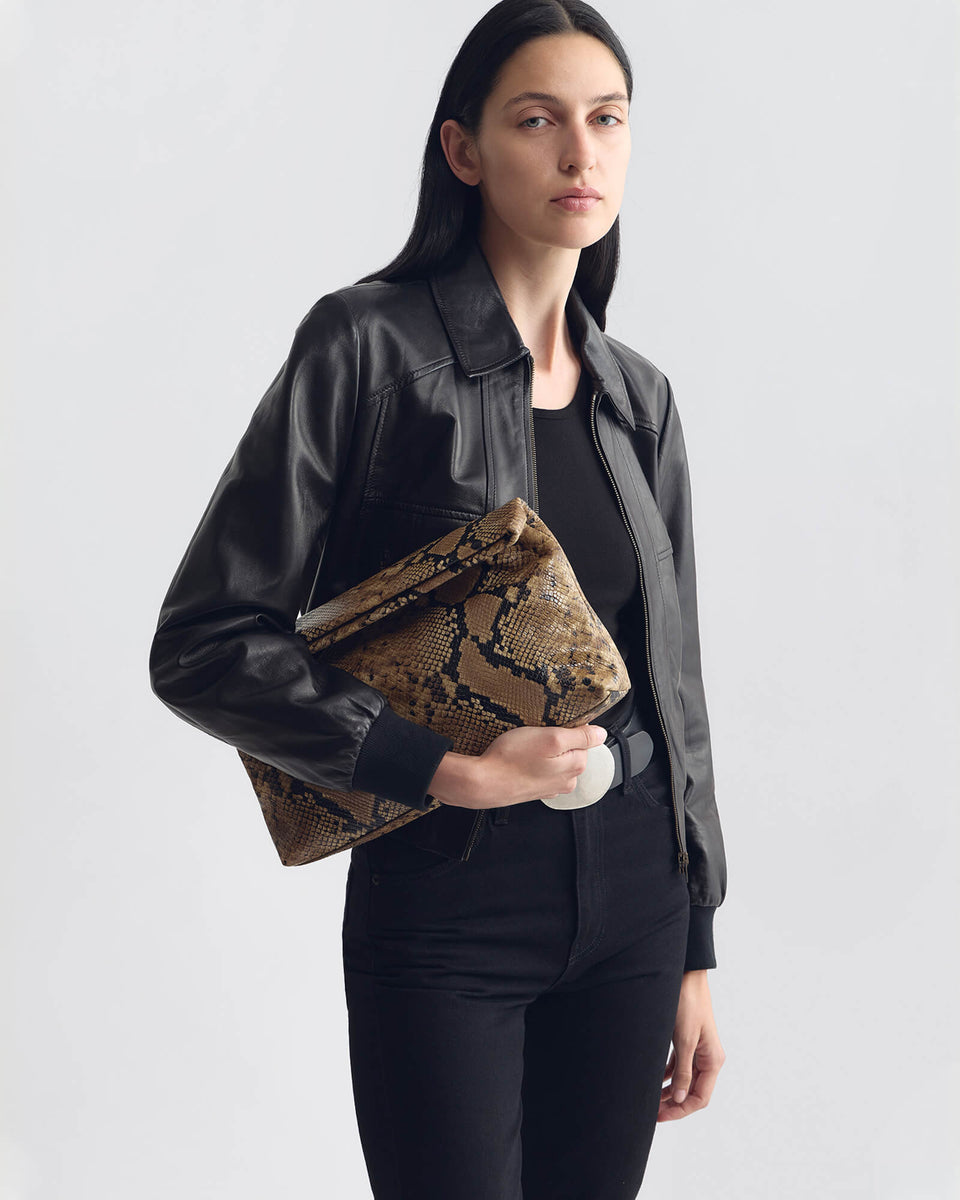JERRY CLUTCH IN TAUPE SNAKESKIN