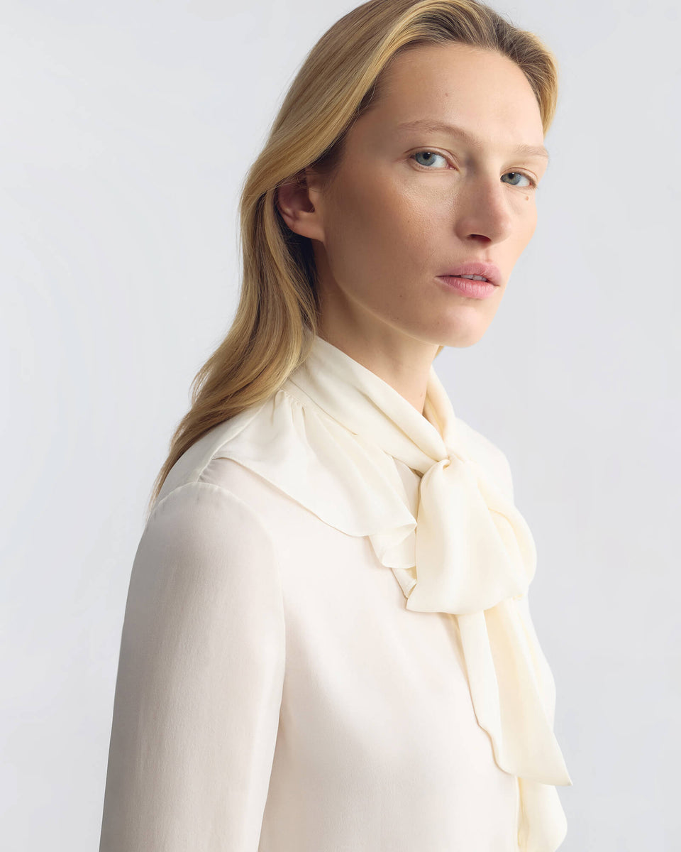 LYA RUFFLE TIE SILK BLOUSE IN IVORY